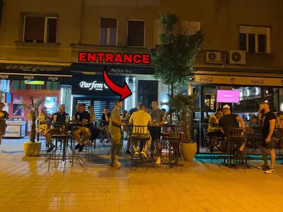 a group of people sitting at tables outside a restaurant at Osho in Smederevo