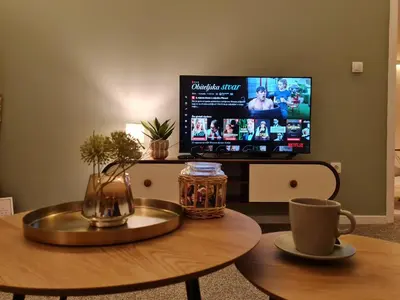 a living room with a coffee table and a tv at Osho in Smederevo