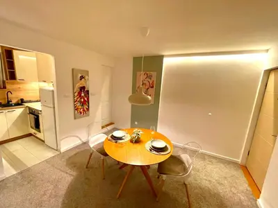 a dining room table and chairs in a kitchen at Osho in Smederevo