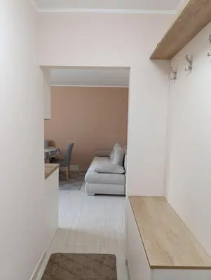 a living room with a couch and a table at Apartman Kokan in Obrenovac
