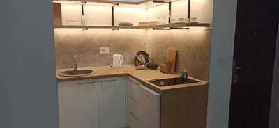 a kitchen with a sink and a counter top at Apartman Andjela in Surčin