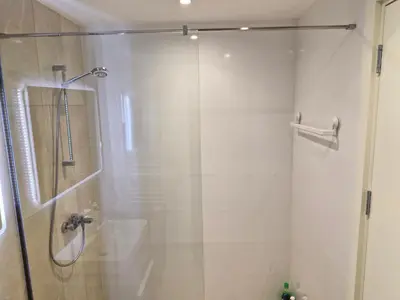 a shower with a glass door in a bathroom at Belgrade Waterfront BW Sava Aqua in Sajmište