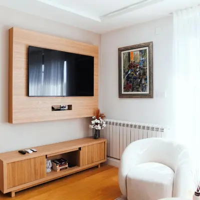 a living room with a flat screen tv on a wall at Belgrade Rooftop Experience, Modern Luxury & Views in Belgrade