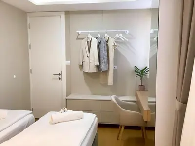 a bathroom with two beds and a bath tub at Belgrade Rooftop Experience, Modern Luxury & Views in Belgrade