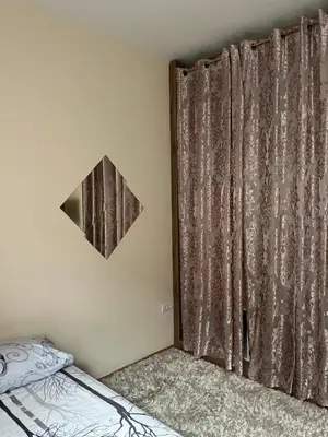 a bedroom with a bed and a mirror on the wall at Sofia in Belgrade
