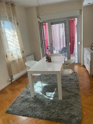 a white table and chairs in a living room at Sofia in Belgrade