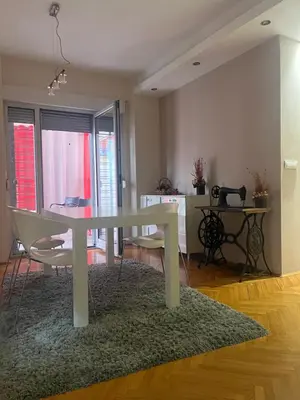 a white table and chairs in a living room at Sofia in Belgrade