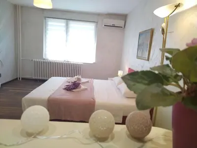 a hotel room with a bed and a window at Lea Beo in Belgrade