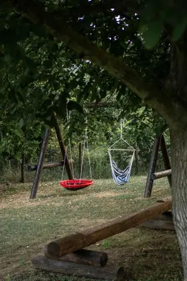 two hammocks on a swing set in a park at Uba Fruška gora in Velika Remeta