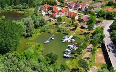 an aerial view of a marina with boats in the water at Ćirino Sokače in Opovo