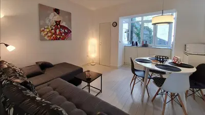 a living room with a couch and a table at Jana - Cozy Apartment in the Old Town in Belgrade