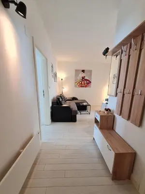 a hallway with a living room with a couch at Jana - Cozy Apartment in the Old Town in Belgrade