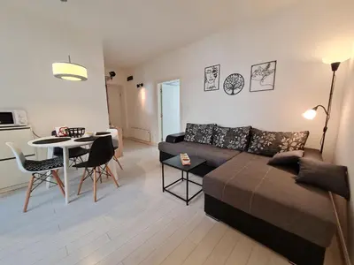 a living room with a couch and a table at Jana - Cozy Apartment in the Old Town in Belgrade
