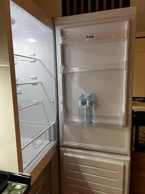 an empty refrigerator with two bottles of water in it at View in Zvezdara
