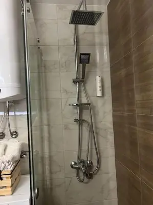 a shower with a glass door in a bathroom at View in Zvezdara