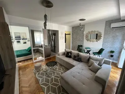 a living room with a couch and a table at Sanja, Old Town in Belgrade