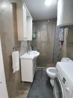 a small bathroom with a sink and a toilet at S Lux in Belgrade