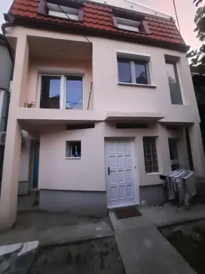 a white house with a white door and windows at S Lux in Belgrade