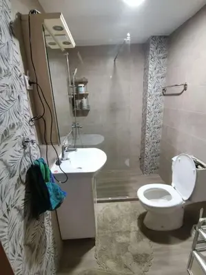 a bathroom with a toilet and a sink and a shower at S Lux in Belgrade