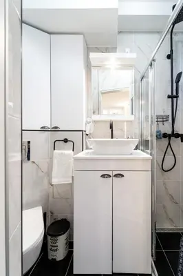 a white bathroom with a sink and a toilet at New Urban Studio in Belgrade