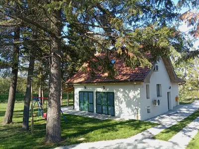 a white house with a red roof at La Casa Sofija in Nemenikuće