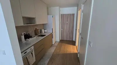 a kitchen with a sink and a refrigerator at Beldorado Apartments - Belgrade Waterfront Luxury Designer Studio in Belgrade