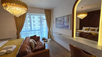 a living room with a couch and a large mirror at Beldorado Apartments - Belgrade Waterfront Luxury Designer Studio in Belgrade