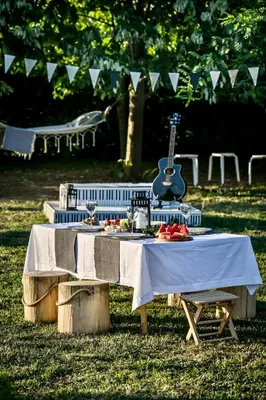 a picnic table with a guitar on top of it at Smart glamp in Bukovik