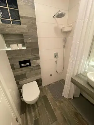 a bathroom with a toilet and a sink at The Style, apartman sa parkingom in Belgrade