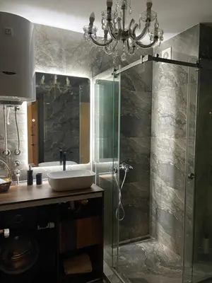 a bathroom with a sink and a glass shower at Lux Tea Pancevo in Pančevo
