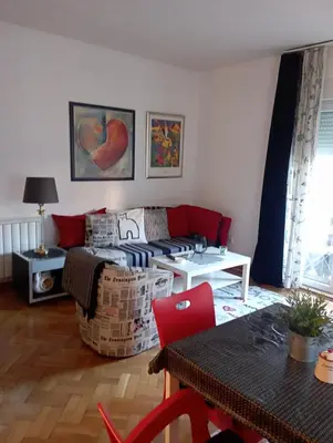 a living room with a couch and a table at Gold Apartments in Belgrade