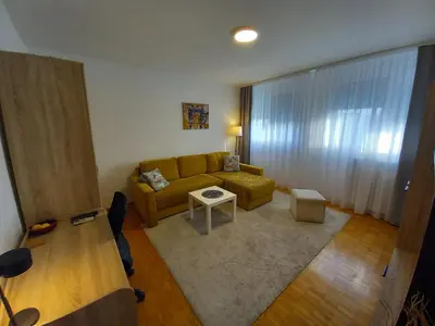 a living room with a couch and a table at Pariske noći in Belgrade