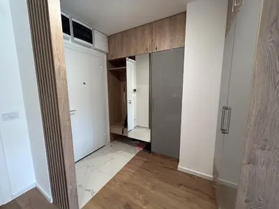 an empty room with a closet and a room with a door at V Park Lux Apartman in Belgrade