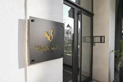 a sign on the side of a building at Black Gallo Residences in Belgrade