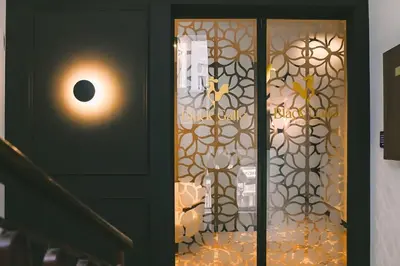 a door with a glass door with a window at Black Gallo Residences in Belgrade