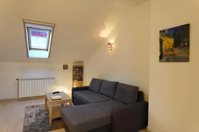 a living room with a couch and a table at Vracar Historical in Vračar (historical)