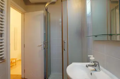 a bathroom with a sink and a shower at Vracar Historical in Vračar (historical)