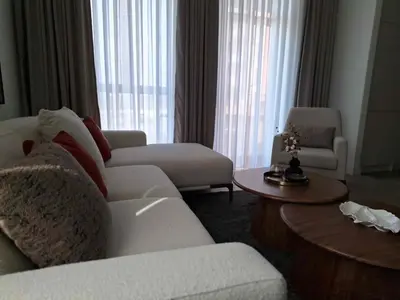 a living room with a white couch and a table at Apartment Belgrade Waterfront LUX -Libera 413 in Belgrade