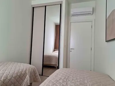 a bedroom with a mirror next to a bed at Apartment Belgrade Waterfront LUX -Libera 413 in Belgrade