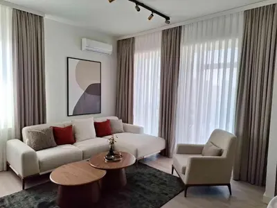 a living room with a couch and a table at Apartment Belgrade Waterfront LUX -Libera 413 in Belgrade