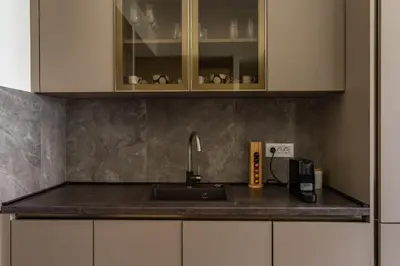 a kitchen counter with a sink and a microwave at Libera Luxe Residence in Belgrade