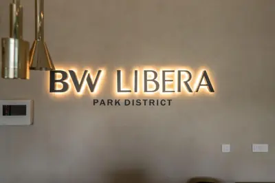 a sign that says bw liliteria on a wall at Libera Luxe Residence in Belgrade