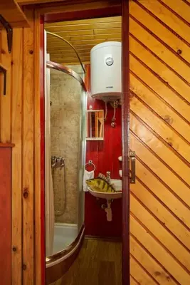 a bathroom with a sink and a shower at Homey house boat, great location in Ada Ciganlija