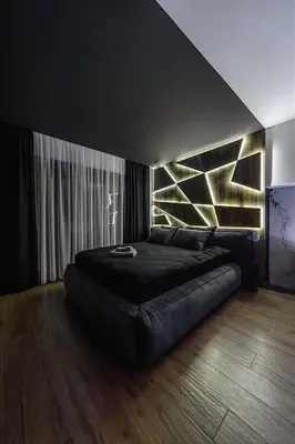a bedroom with a black bed with a leather couch at Dark Nest 1 Belgrade Apartments in Zvezdara