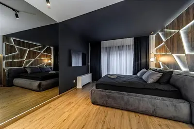 a black bedroom with a bed and a couch at Dark Nest 1 Belgrade Apartments in Zvezdara