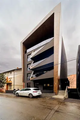 a white car parked in front of a building at Dark Nest 1 Belgrade Apartments in Zvezdara