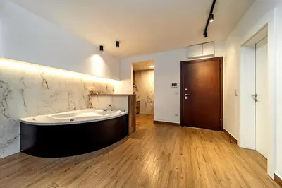 a large bathroom with a tub in the middle of the room at Dark Nest 1 Belgrade Apartments in Zvezdara