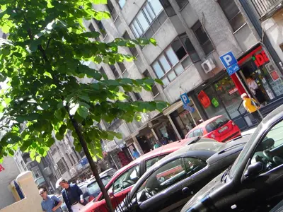 a group of cars parked in a parking lot at Apartment Vracar in Belgrade