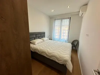 a bedroom with a bed and a window at K District apartment Belgrade - central BG, private parking in Belgrade