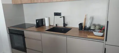 a kitchen with a sink and a counter top at K District apartment Belgrade - central BG, private parking in Belgrade